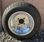 Douglas Green Label Polished Aluminum Wheel 10x7 4x4 With Arisun 205/50/10 Tire. Fixed Price $49.99.
